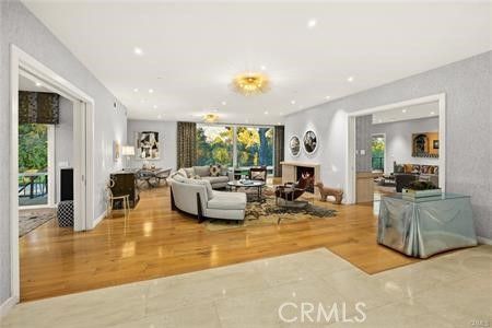 Chandelier, Fireplace, Interior, Living room, Recessed Lighting, Wood Texture Flooring
