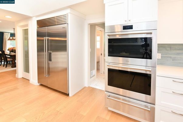 Dining room, Interior, Kitchen, Recessed Lighting, Stainless Steel Appliances, Wood Texture Flooring