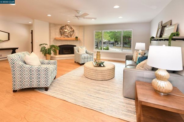 Fireplace, Interior, Living room, Recessed Lighting, Stone Walls, Wood Texture Flooring