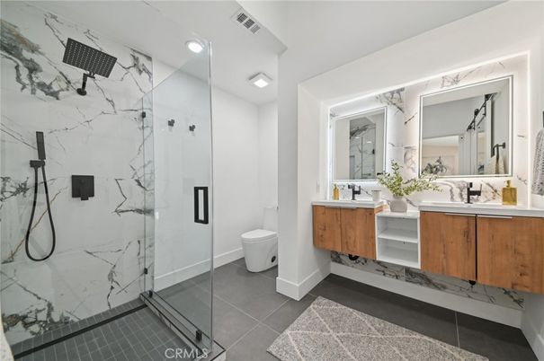 Bathroom, Dual Sink Vanities, Glass Shower, Interior, Marble Walls, Recessed Lighting