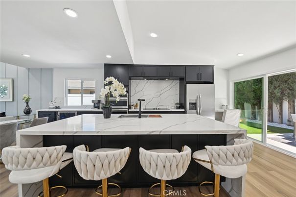 Interior, Kitchen, Marble Walls, Recessed Lighting, Stainless Steel Appliances, Wood Texture Flooring