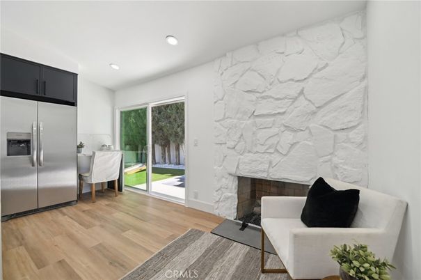 Fireplace, Interior, Kitchen, Marble Walls, Recessed Lighting, Stainless Steel Appliances, Stone Walls, Wood Texture Flooring