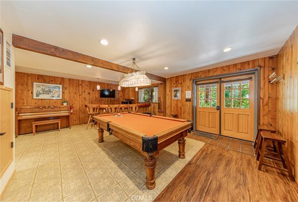 Billiard Table, Chandelier, Game Room, Interior, Recessed Lighting, Wood Texture Flooring, Wooden Walls