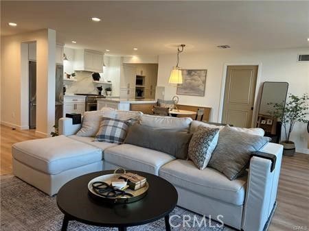 Dining room, Interior, Kitchen, Living room, Pendant Lights, Recessed Lighting, Stainless Steel Appliances, Wood Texture Flooring