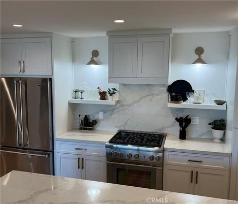 Interior, Kitchen, Marble Walls, Recessed Lighting, Stainless Steel Appliances