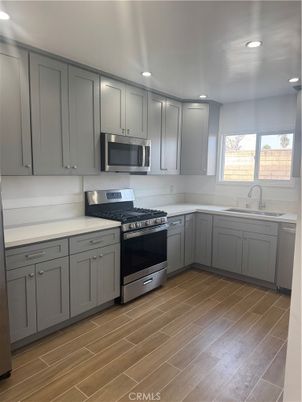Interior, Kitchen, Recessed Lighting, Stainless Steel Appliances, Wood Texture Flooring