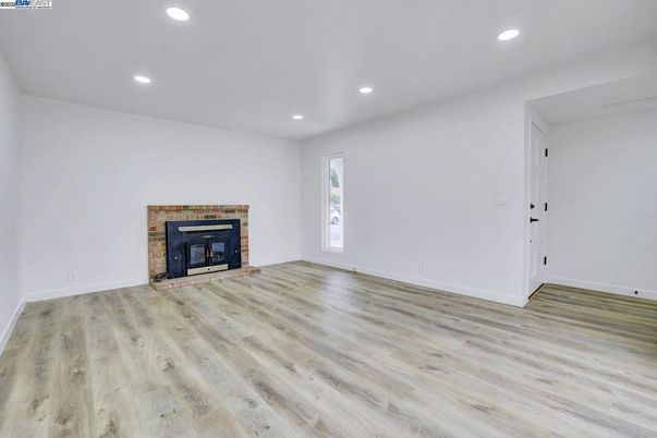 Empty room, Fireplace, Interior, Recessed Lighting, Wood Texture Flooring