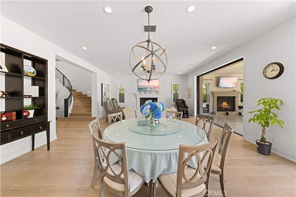 Chandelier, Dining room, Fireplace, Interior, Pendant Lights, Recessed Lighting, Wood Texture Flooring