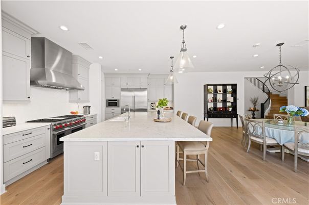Chandelier, Dining room, Interior, Kitchen, Pendant Lights, Recessed Lighting, Stainless Steel Appliances, Wood Texture Flooring