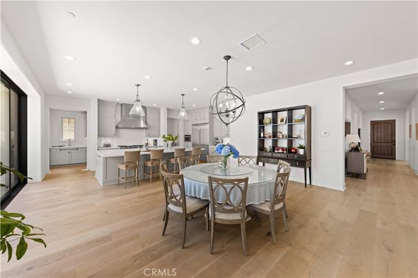Chandelier, Dining room, Interior, Kitchen, Pendant Lights, Recessed Lighting, Stainless Steel Appliances, Wood Texture Flooring