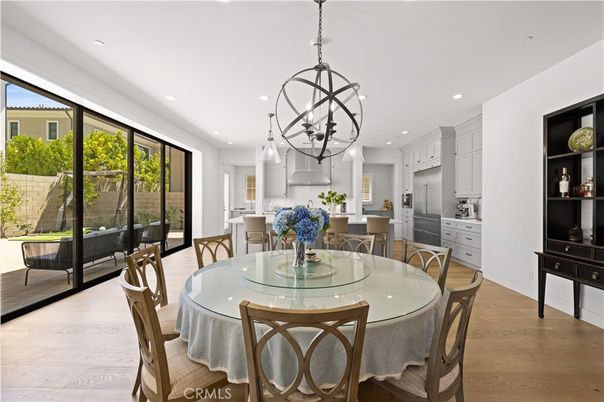 Chandelier, Dining room, Interior, Kitchen, Pendant Lights, Recessed Lighting, Stainless Steel Appliances, Wood Texture Flooring