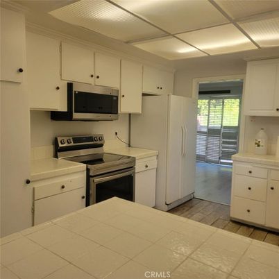 Interior, Kitchen, Tile Countertops, Wood Texture Flooring