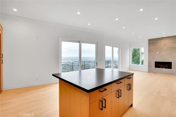 Empty room, Fireplace, Interior, Recessed Lighting, Water, Wood Texture Flooring