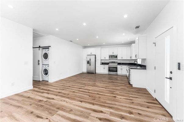Interior, Kitchen, Recessed Lighting, Stainless Steel Appliances, Washer, Wood Texture Flooring