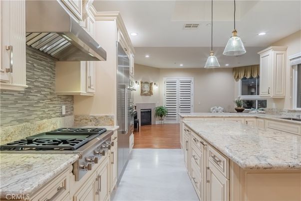 Fireplace, Interior, Kitchen, Pendant Lights, Recessed Lighting, Stainless Steel Appliances, Wood Texture Flooring