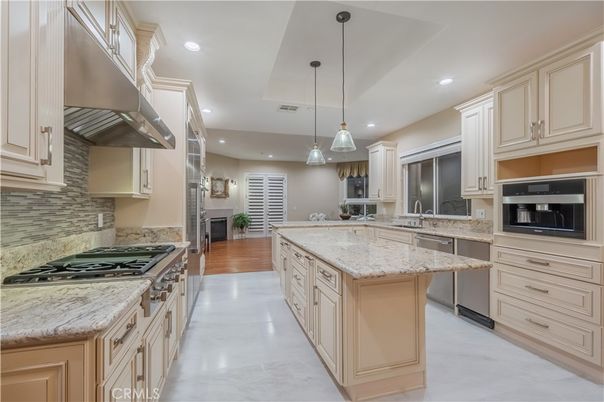 Fireplace, Interior, Kitchen, Pendant Lights, Recessed Lighting, Stainless Steel Appliances, Wood Texture Flooring