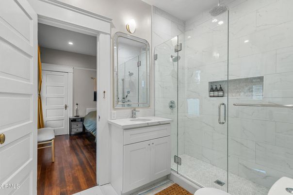 Bathroom, Glass Shower, Interior, Marble Walls, Recessed Lighting, Wood Texture Flooring
