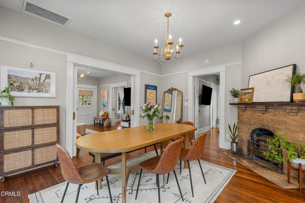 Chandelier, Dining room, Fireplace, Interior, Recessed Lighting, Stone Walls, Wood Texture Flooring