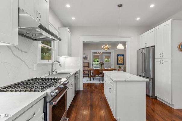 Chandelier, Dining room, Interior, Kitchen, Pendant Lights, Recessed Lighting, Stainless Steel Appliances, Wood Texture Flooring