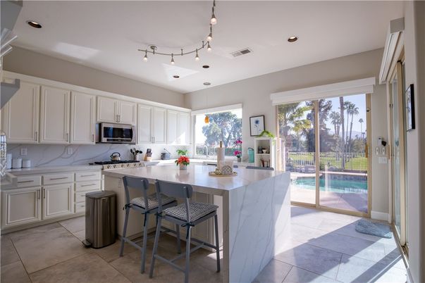 Interior, Kitchen, Marble Walls, Recessed Lighting, Stainless Steel Appliances
