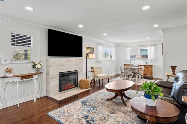 Dining room, Fireplace, Interior, Living room, Recessed Lighting, Wood Texture Flooring