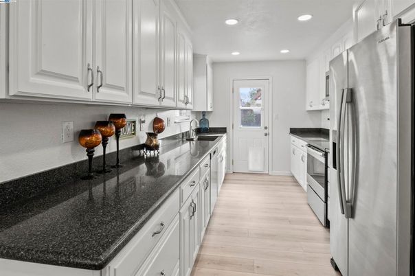 Interior, Kitchen, Recessed Lighting, Stainless Steel Appliances, Wood Texture Flooring