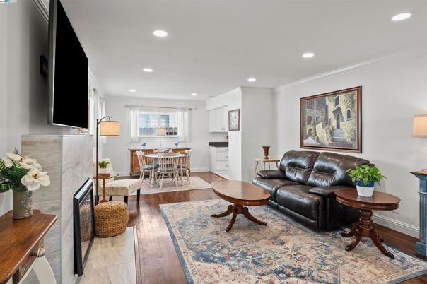 Dining room, Fireplace, Interior, Living room, Recessed Lighting, Wood Texture Flooring