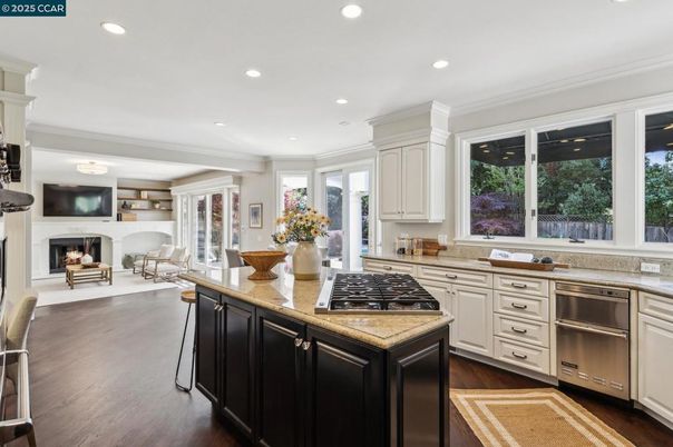 Dining room, Fireplace, Interior, Kitchen, Recessed Lighting, Stainless Steel Appliances, Wood Texture Flooring