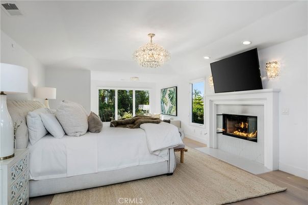 Bedroom, Chandelier, Fireplace, Interior, Recessed Lighting, Wood Texture Flooring