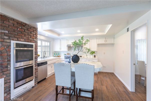 Interior, Kitchen, Recessed Lighting, Stainless Steel Appliances, Stone Walls, Wood Texture Flooring