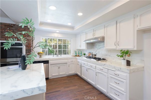 Interior, Kitchen, Recessed Lighting, Stainless Steel Appliances, Stone Walls, Wood Texture Flooring