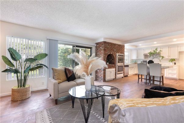Fireplace, Interior, Kitchen, Living room, Recessed Lighting, Stainless Steel Appliances, Stone Walls, Wood Texture Flooring