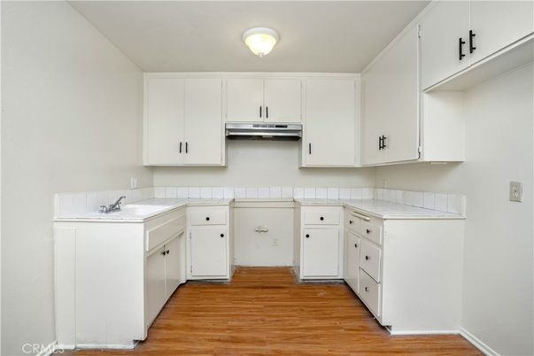 Interior, Kitchen, Tile Countertops, Wood Texture Flooring