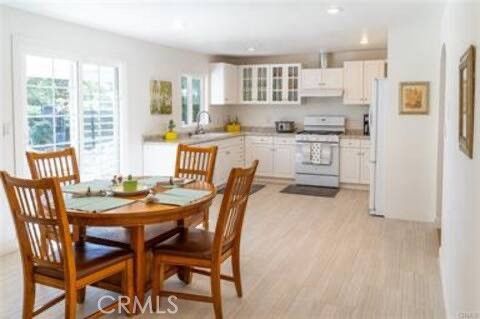 Dining room, Interior, Kitchen, Recessed Lighting, Stainless Steel Appliances, Wood Texture Flooring