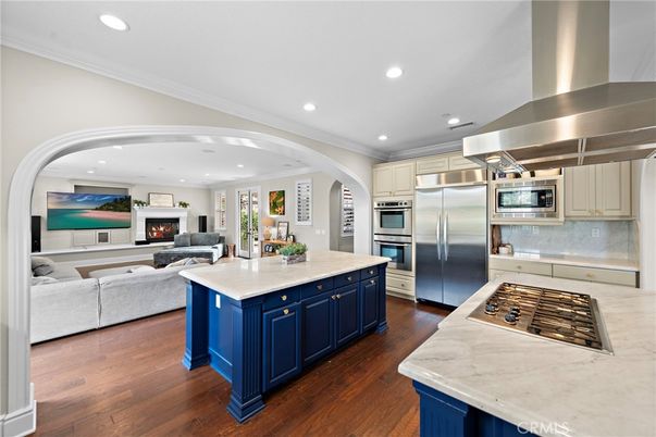 Fireplace, Interior, Kitchen, Living room, Recessed Lighting, Stainless Steel Appliances, Wood Texture Flooring
