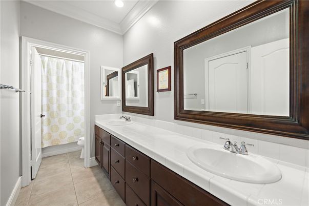 Bathroom, Dual Sink Vanities, Interior, Recessed Lighting, Tile Countertops