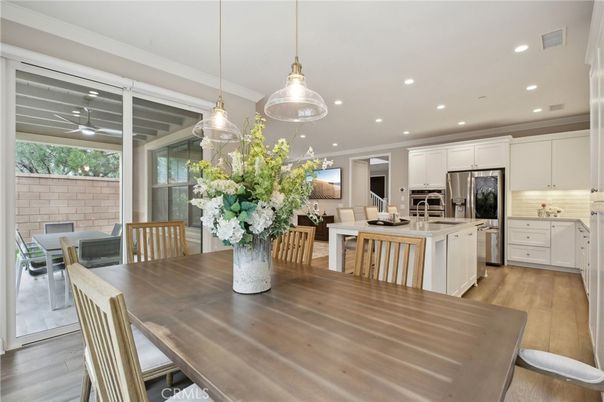 Dining room, Interior, Kitchen, Pendant Lights, Recessed Lighting, Stainless Steel Appliances, Wood Texture Flooring