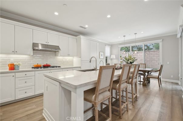 Dining room, Interior, Kitchen, Pendant Lights, Recessed Lighting, Stainless Steel Appliances, Wood Texture Flooring