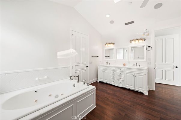 Bathroom, Dual Sink Vanities, Interior, Recessed Lighting, Tile Countertops, Wood Texture Flooring