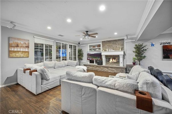 Fireplace, Interior, Living room, Recessed Lighting, Stone Walls, Wood Texture Flooring