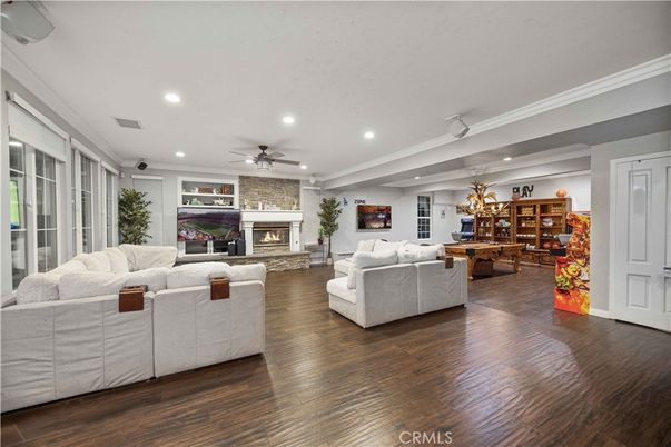 Dining room, Fireplace, Interior, Living room, Recessed Lighting, Wood Texture Flooring