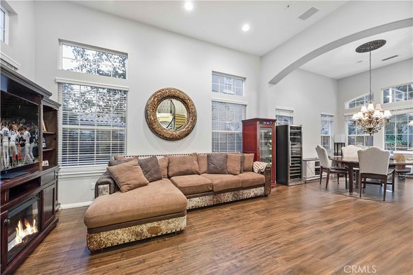 Chandelier, Dining room, Fireplace, Interior, Living room, Recessed Lighting, Wood Texture Flooring
