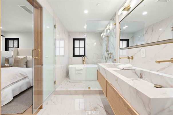 Bathroom, Dual Sink Vanities, Free Standing Baths, Glass Shower, Interior, Marble, Marble Walls, Recessed Lighting