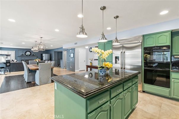 Chandelier, Dining room, Interior, Kitchen, Living room, Pendant Lights, Recessed Lighting, Stainless Steel Appliances, Wood Texture Flooring