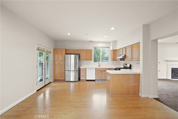 Fireplace, Interior, Kitchen, Recessed Lighting, Stainless Steel Appliances, Wood Texture Flooring