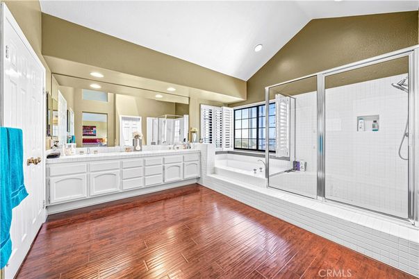 Bathroom, Dual Sink Vanities, Glass Shower, Interior, Recessed Lighting, Wood Texture Flooring
