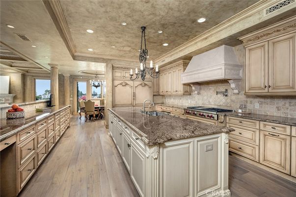 Chandelier, Dining room, Interior, Kitchen, Recessed Lighting, Stainless Steel Appliances, Wood Texture Flooring