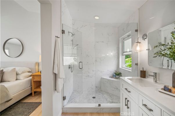 Bathroom, Glass Shower, Interior, Marble Walls, Recessed Lighting, Wood Texture Flooring