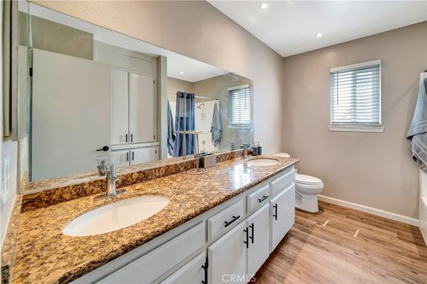 Bathroom, Dual Sink Vanities, Interior, Recessed Lighting, Wood Texture Flooring