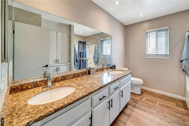 Bathroom, Dual Sink Vanities, Interior, Recessed Lighting, Wood Texture Flooring